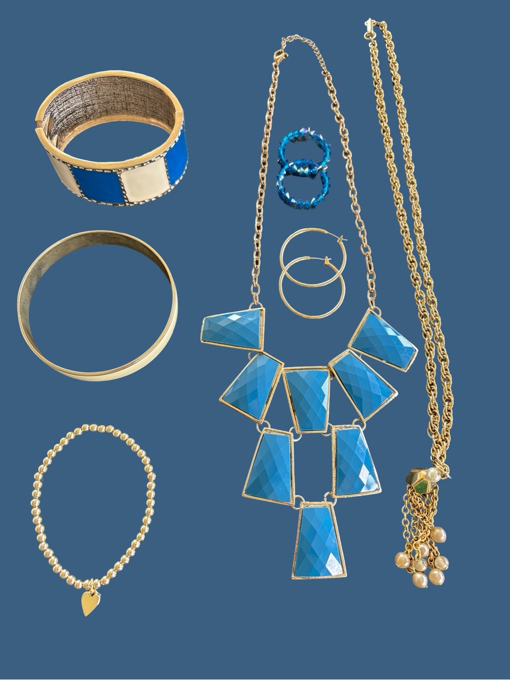 Bright blue and gold tone jewelry set.